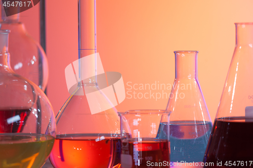 Image of Backlit laboratory test flask containing colorful liquids.