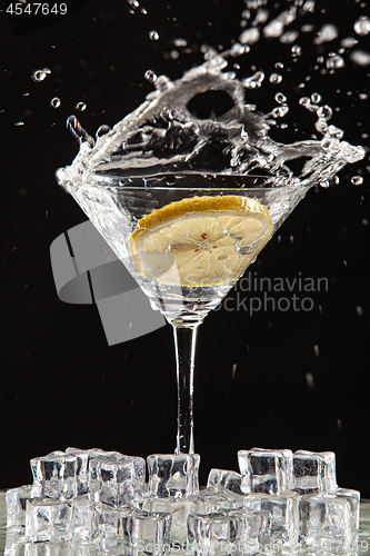 Image of Glass, Lemon And Splash Of Water