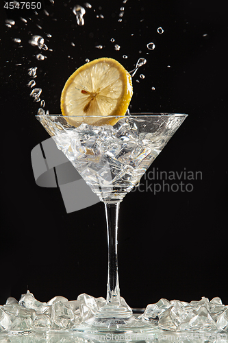 Image of Glass, Lemon And Splash Of Water