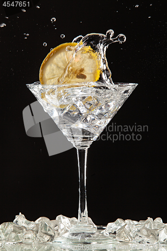Image of Glass, Lemon And Splash Of Water