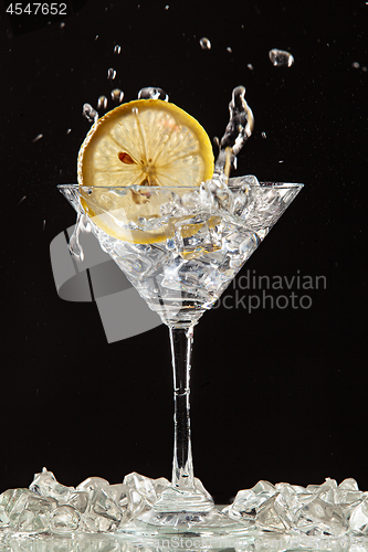 Image of Glass, Lemon And Splash Of Water