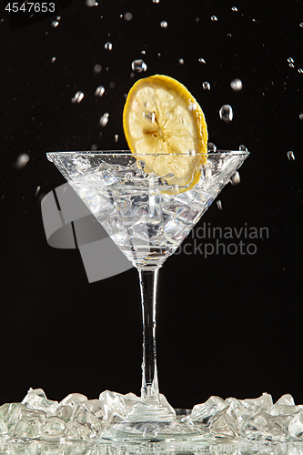 Image of Glass, Lemon And Splash Of Water