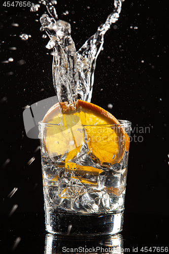 Image of Glass, Orange, Ice And Splashes
