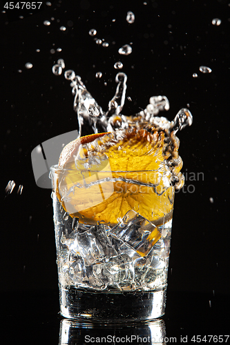 Image of Glass, Orange, Ice And Splashes