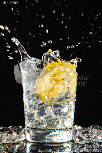 Image of Glass Of Water, Ice And Lemon