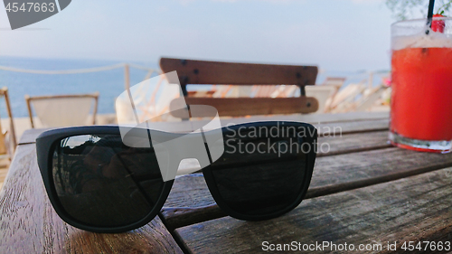 Image of Sunglasses range cocktail on the wooden table