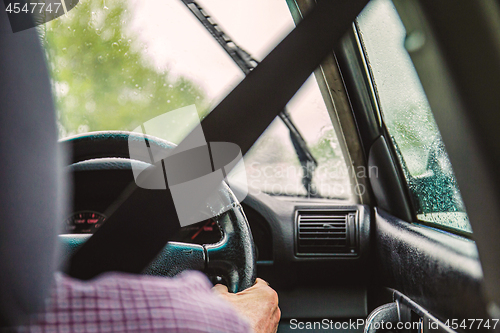 Image of Man in car with Seatbelt