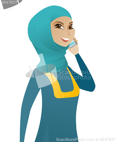 Image of Muslim business woman talking on a mobile phone.