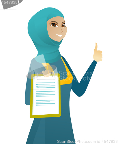 Image of Business woman with clipboard giving thumb up.