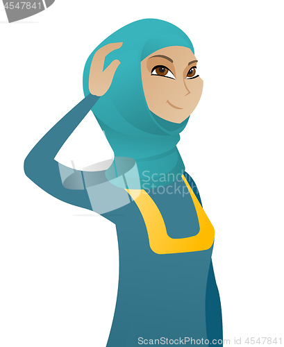 Image of Young muslim business woman scratching her head.