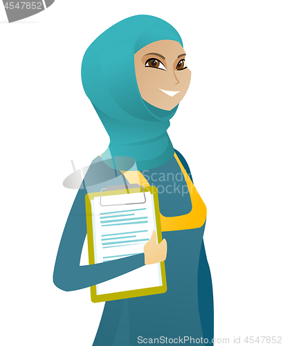 Image of Business woman holding clipboard with documents.