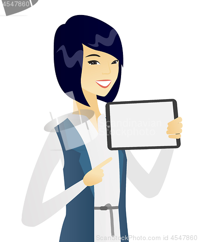 Image of Young asian business woman holding tablet computer