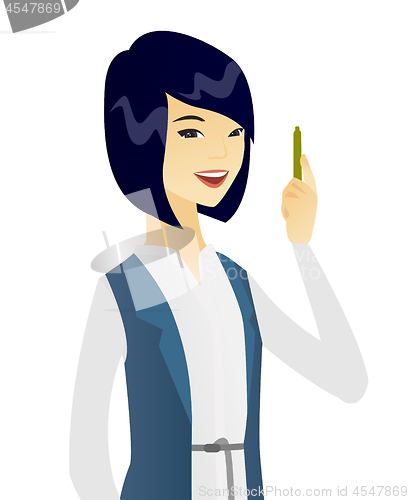 Image of Young asian smiling business woman with a pen.