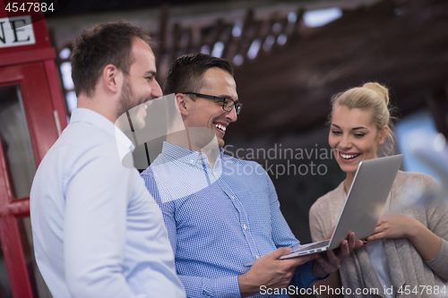 Image of Business team Working With laptop in creative office