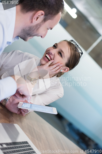 Image of Business People Working With Tablet in startup office