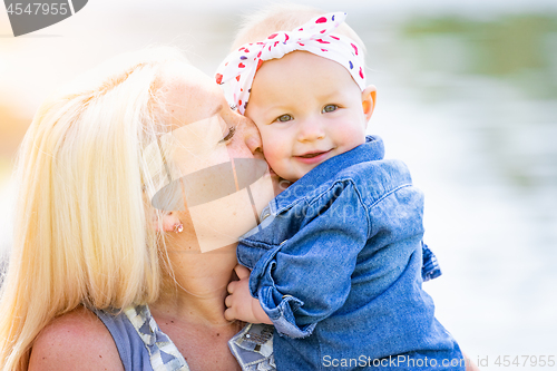 Image of Young Caucasian Mother and Daughter At The Park