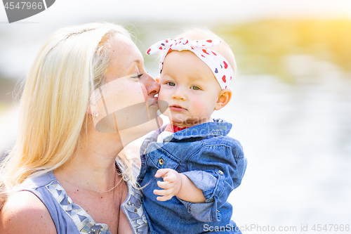 Image of Young Caucasian Mother and Daughter At The Park