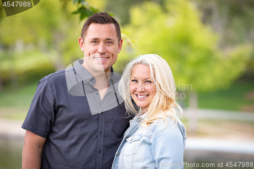 Image of Young Caucasian Couple Portrait In The Park