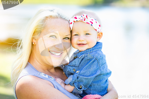 Image of Young Caucasian Mother and Daughter At The Park