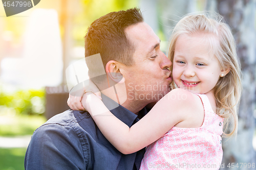 Image of Young Caucasian Father and Daughter Having Fun At The Park