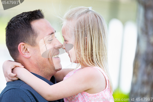 Image of Young Caucasian Father and Daughter Having Fun At The Park