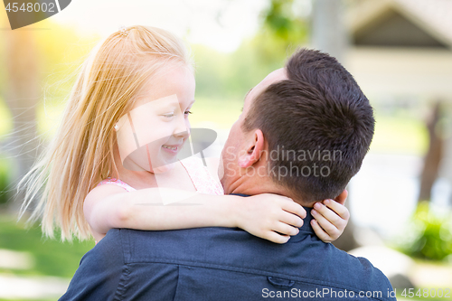 Image of Young Caucasian Father and Daughter Having Fun At The Park