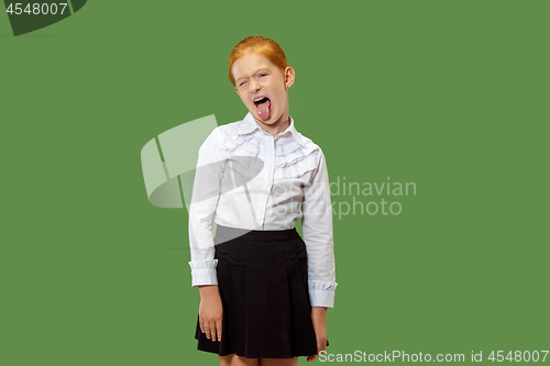 Image of The squint eyed woman with weird expression isolated on green