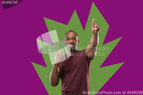 Image of Winning success man happy ecstatic celebrating being a winner. Dynamic energetic image of male model