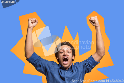 Image of Winning success man happy ecstatic celebrating being a winner. Dynamic energetic image of male model