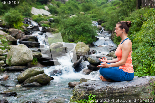 Image of Woman in Padmasana outdoors