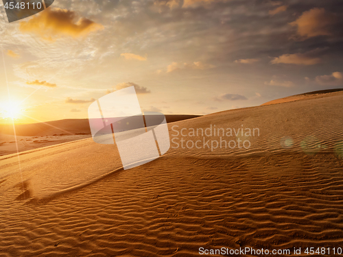 Image of White sand dunes on sunrise, Mui Ne, Vietnam