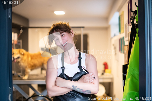 Image of portrait of professional pet hairdresser hipster woman