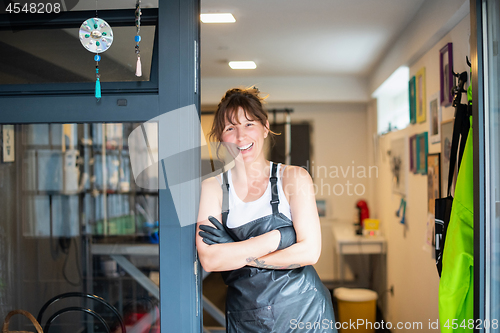 Image of portrait of professional pet hairdresser hipster woman