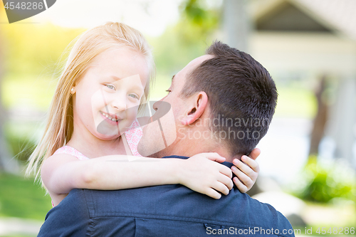 Image of Young Caucasian Father and Daughter Having Fun At The Park