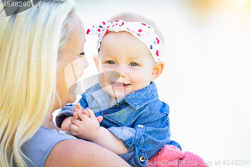 Image of Young Caucasian Mother and Daughter At The Park