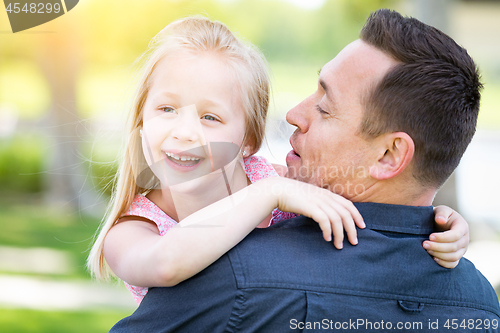 Image of Young Caucasian Father and Daughter Having Fun At The Park