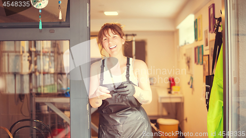 Image of portrait of professional pet hairdresser hipster woman