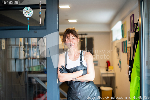 Image of portrait of professional pet hairdresser hipster woman