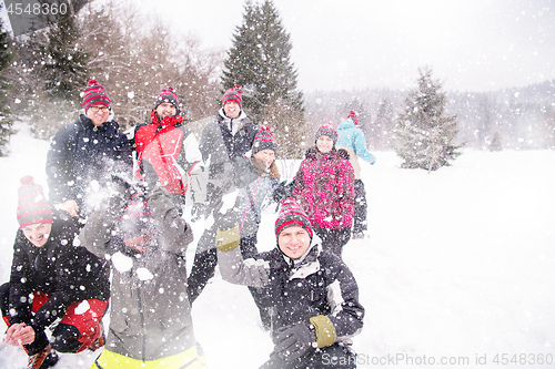 Image of group of young people throwing snow in the air