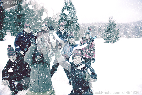 Image of group of young people throwing snow in the air