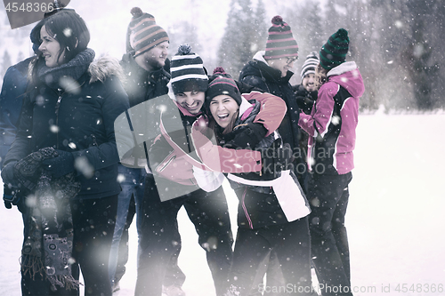 Image of portrait of group young people in beautiful winter landscape