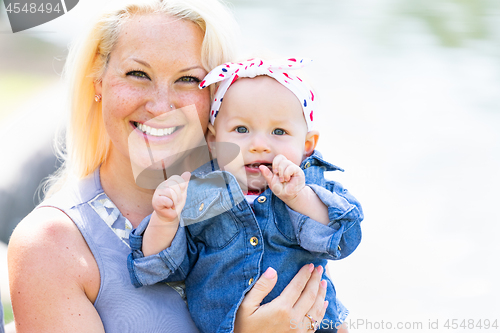 Image of Young Caucasian Mother and Daughter At The Park