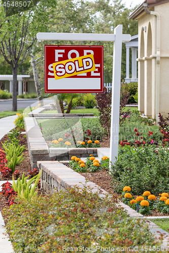 Image of Sold Home For Sale Real Estate Sign in Front of New House