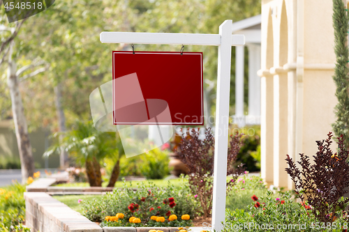 Image of Blank Sale Real Estate Sign in Front of House