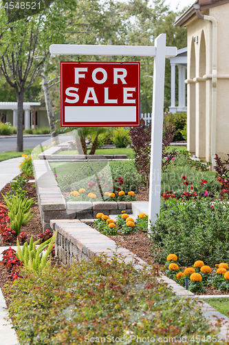 Image of Home For Sale Real Estate Sign in Front of New House