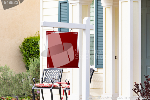 Image of Blank Sale Real Estate Sign in Front of House