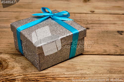 Image of Gift box with blue ribbon