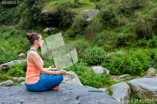 Image of Woman in Padmasana outdoors