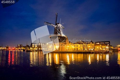 Image of Harlem landmark  windmill De Adriaan on Spaarne river. Harlem,  