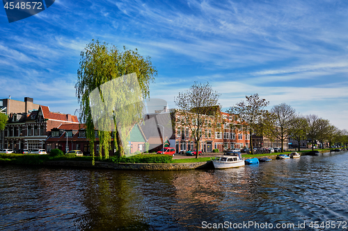 Image of Boats, houses and canal. Harlem, Netherlands